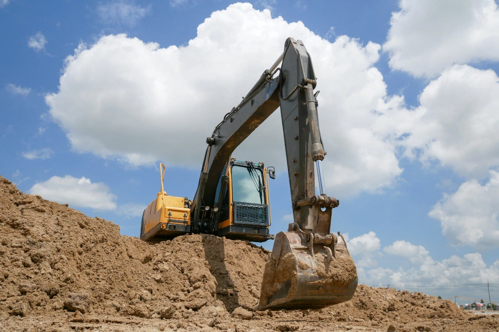 Site excavation and soil removal for foundation construction using heavy equipment in Los Angeles